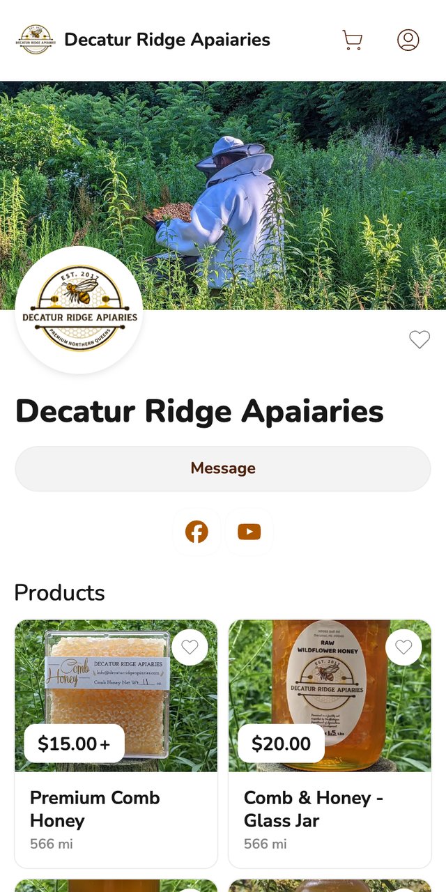 Phone screenshot of the Decatur Ridge Apaiaries storefront on Homegrown, showing a banner photo of a beekeeper in a white suit among tall green plants, a round bee logo marked EST. 2017, a Message button, and two products: a clear box of comb honey with a band label, and a glass jar of honey with an oval cream label reading Raw Wildflower Honey